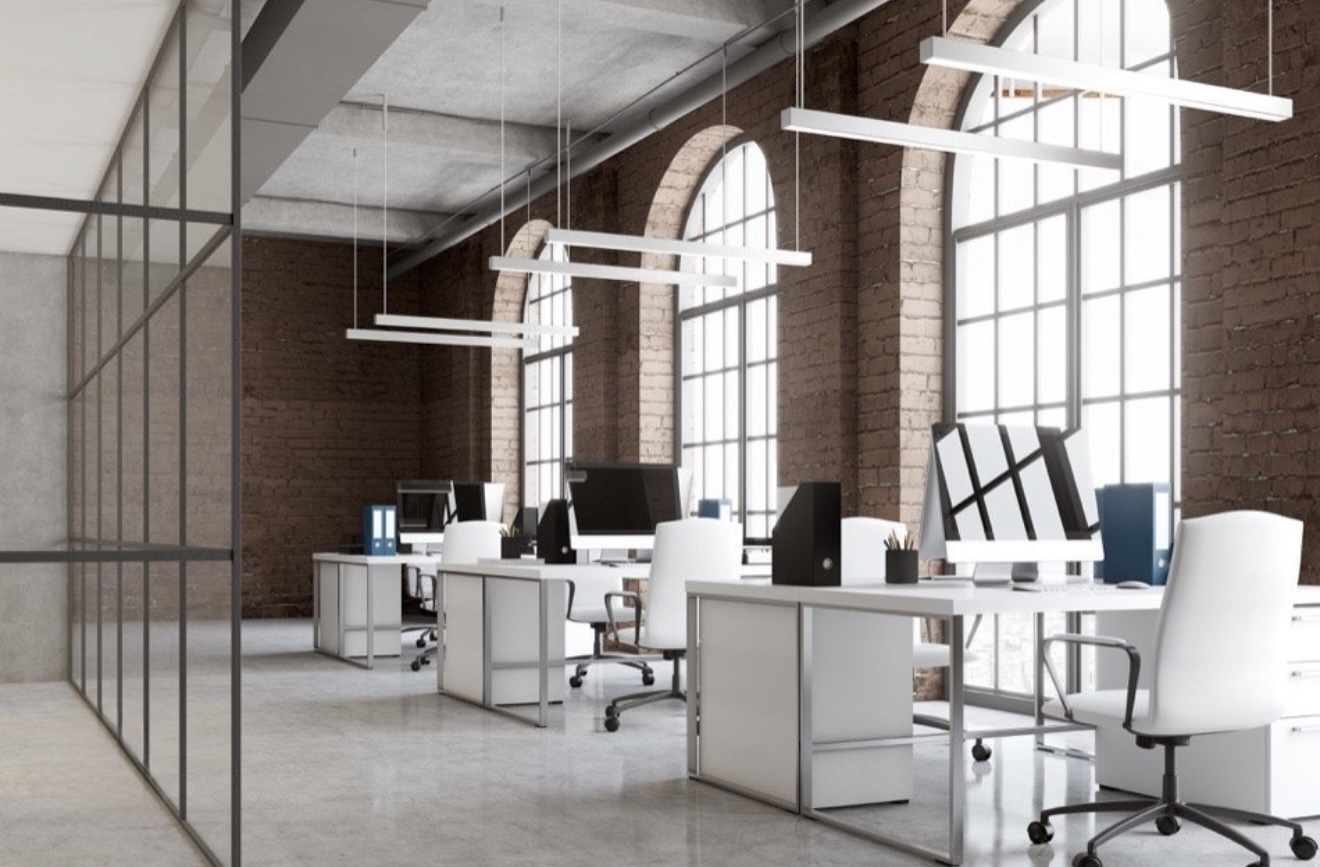 Brick-walled modern office with pendant lighting
